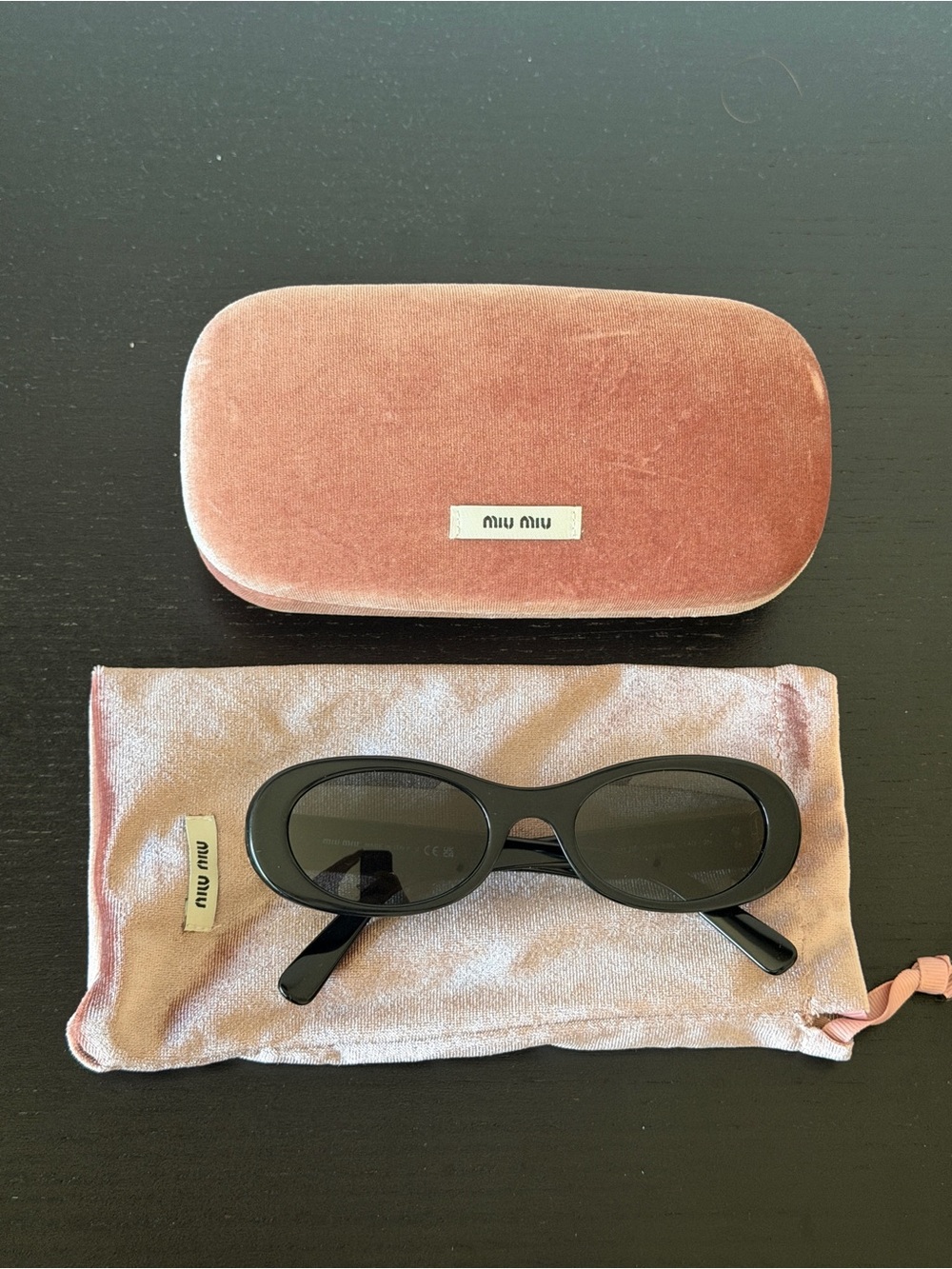 Miu Miu Black Oval Sunglasses with Pink Velvet Case and Pouch